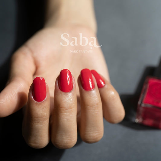Saba Fantasy Red is a bold ruby-inspired nail polish. Bright, breathable, and toxin-free. Vegan, long-lasting, and stunning on all skin tones.
