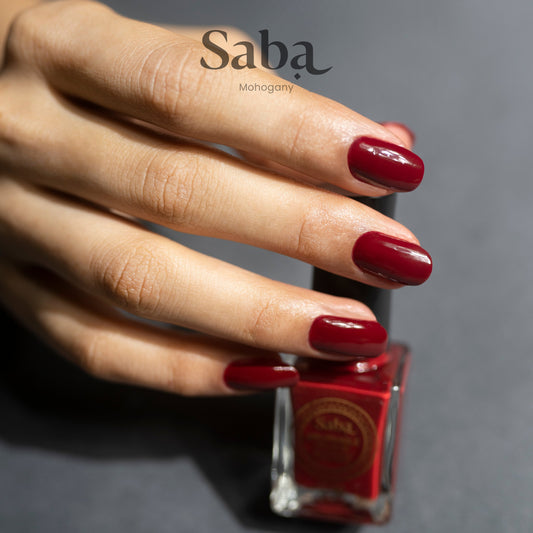 Our best-selling shade! Saba Mahogany Red is a deep, bold red breathable nail polish. Long-lasting, vegan, and toxin-free for everyday elegance.